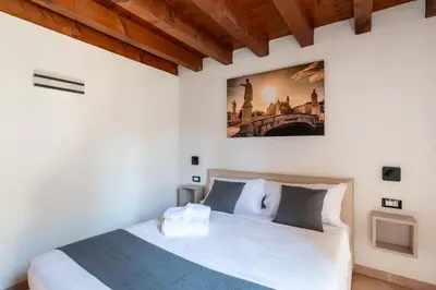 Letto o letti in una camera di GuestHost - Santo 86 Luxury Rooms