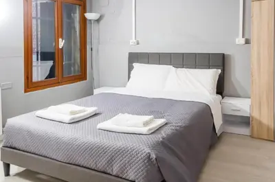 Letto o letti in una camera di room with private bathrooms diedo 2