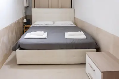 Letto o letti in una camera di room with private bathroom Stella 1