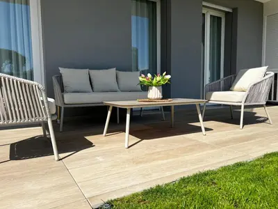 Area soggiorno di Jesolo Pineta Fronte Mare - Jl Blue Apartments C5