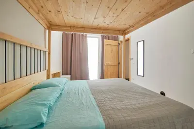 Letto o letti in una camera di Da Brussio