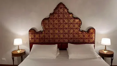Letto o letti in una camera di Comedia by Suites alla Maddalena