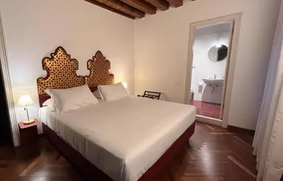 Letto o letti in una camera di Comedia by Suites alla Maddalena