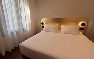 Letto o letti in una camera di Madera by Suites alla Maddalena