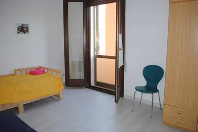 Letto o letti in una camera di Casa Amarilla Sacra Famiglia Padova