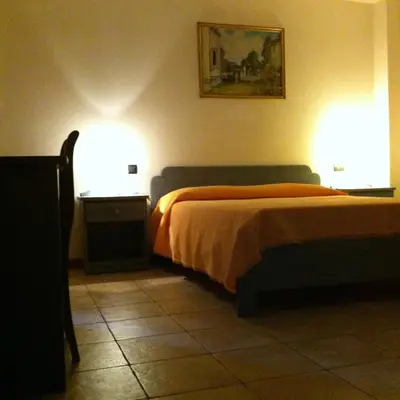 Letto o letti in una camera di RosArancio