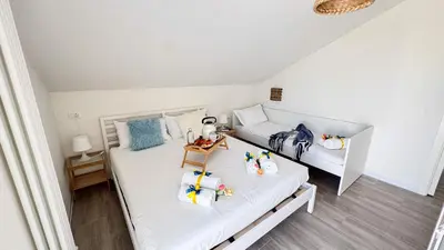 Letto o letti in una camera di Rooftop Blu Infinito by Ca-Sa Check