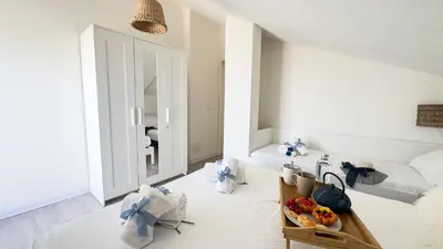 Letto o letti in una camera di Rooftop Blu Infinito by Ca-Sa Check