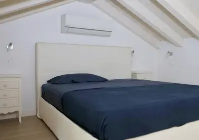 Letto o letti in una camera di CasaMarchi