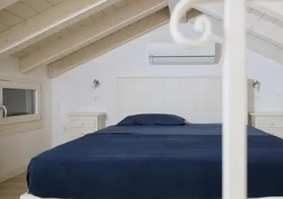 Letto o letti in una camera di CasaMarchi