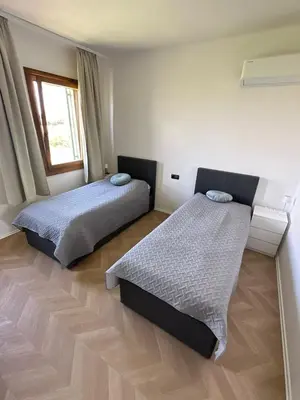 Letto o letti in una camera di Casa Cabini Piave