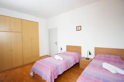 Letto o letti in una camera di Ostello AMDG