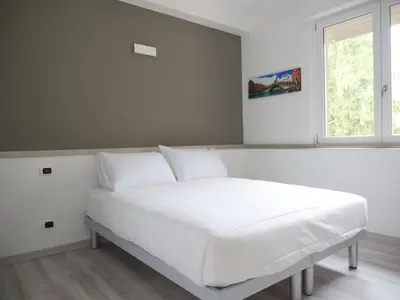 Letto o letti in una camera di Casa Villaggio Laguna