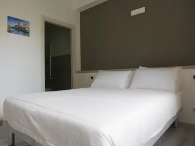 Letto o letti in una camera di Casa Villaggio Laguna