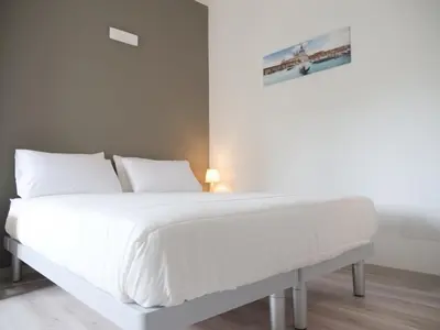 Letto o letti in una camera di Casa Villaggio Laguna