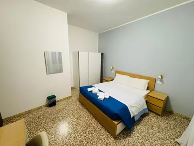 Letto o letti in una camera di MMM HOME Train Station 1