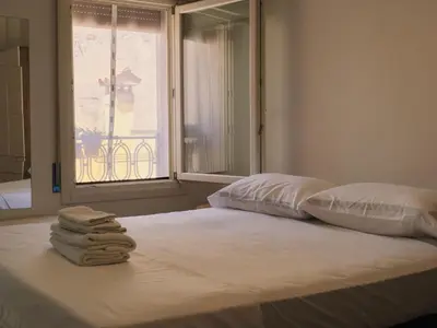 Letto o letti in una camera di Duomo Affascinante Monolocale