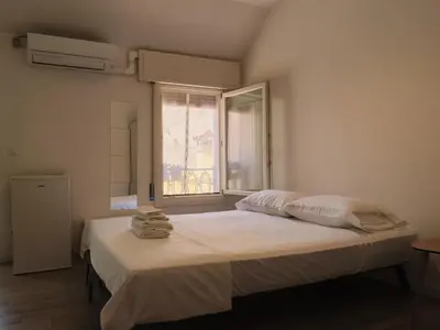 Letto o letti in una camera di Duomo Affascinante Monolocale