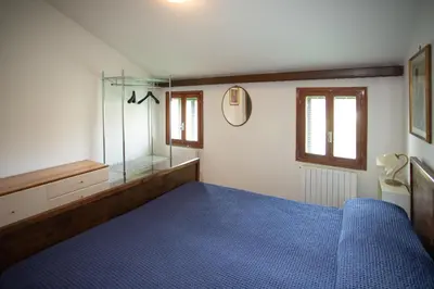 Letto o letti in una camera di Dimora CaGigi Isola di Pellestrina Ve