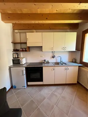 Cucina o angolo cottura di Il giardino di Anna- appartamenti con giardino privato