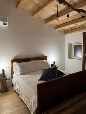 Letto o letti in una camera di Casa Colli Impervi