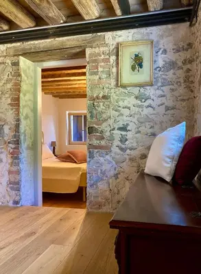 Letto o letti in una camera di Casa Colli Impervi