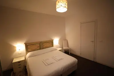 Letto o letti in una camera di Cà Dolce Vita