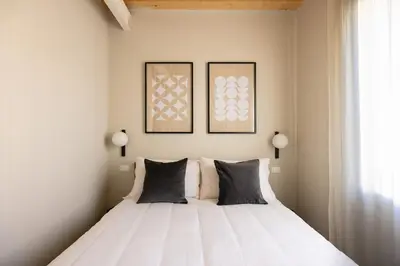 Letto o letti in una camera di PALAZZO CIVIDALE Central Luxury Suite 02