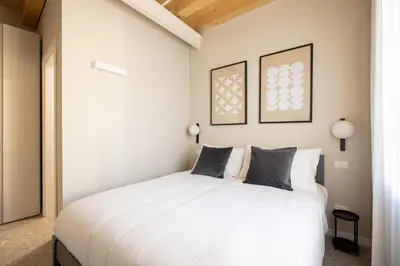 Letto o letti in una camera di PALAZZO CIVIDALE Central Luxury Suite 02