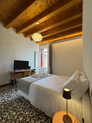 Letto o letti in una camera di Palazzo Marinali Guest House