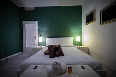 Letto o letti in una camera di Ohana