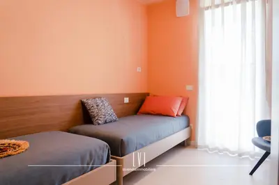 Letto o letti in una camera di OasiSole Suite con terrazza e piscina