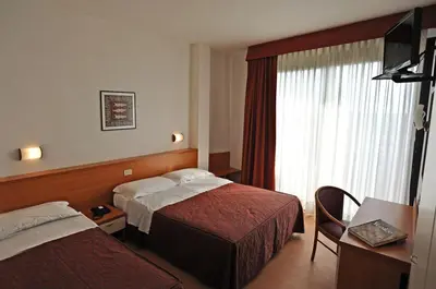 Letto o letti in una camera di Hotel Fenix