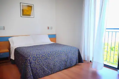 Letto o letti in una camera di Hotel Fenix