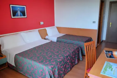 Letto o letti in una camera di Hotel Fenix