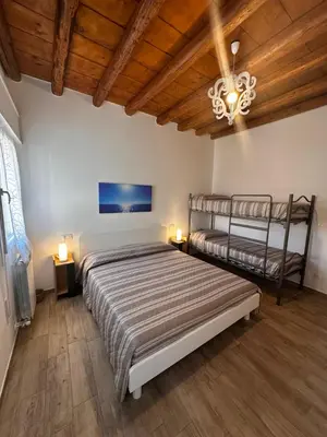 Letto o letti in una camera di Appartamento Ravagnan 4 persone 1 camera da letto