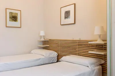 Letto o letti in una camera di Giulio Apartment-Train Station