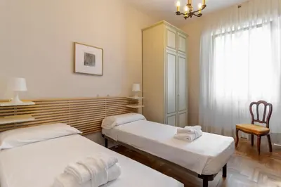 Letto o letti in una camera di Giulio Apartment-Train Station