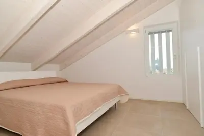 Letto o letti in una camera di Attico 6 posti letto Zona Piazza Aurora 280m dal mare