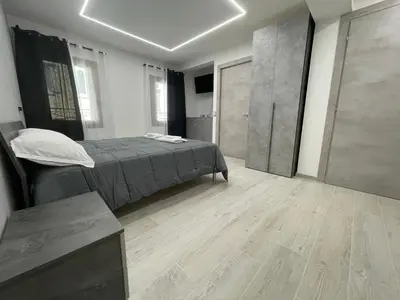 Letto o letti in una camera di Locazione turistica AL PORTO