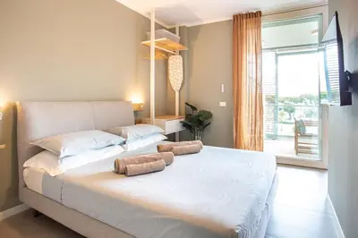 Letto o letti in una camera di Jesolo Vista Lido - Rooftop Suite
