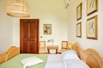 Letto o letti in una camera di Villa Montalban Ghetti - La Fiorita