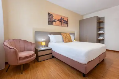 Letto o letti in una camera di Ca' Spadaria San Marco Family Apartment