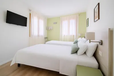Letto o letti in una camera di Suite Mondrian e Suite Monet 100m dalla Biennale