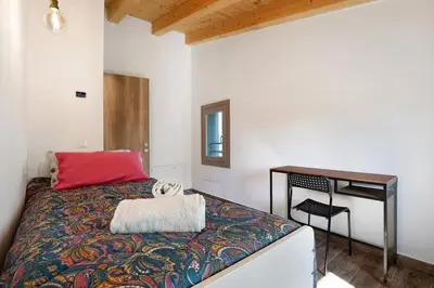 Letto o letti in una camera di with free parking at the Corte dell'Angelo