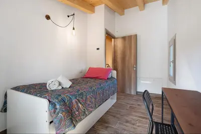 Letto o letti in una camera di with free parking at the Corte dell'Angelo