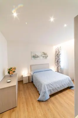 Letto o letti in una camera di EnJoy Home - Appartamento Terra, Il Canterale