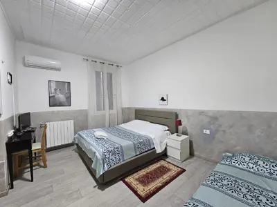 Letto o letti in una camera di Hotel Giovannina