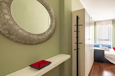 Letto o letti in una camera di GuestHost - Porta Portello Cozy Apartment Padova