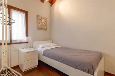 Letto o letti in una camera di San Vito Sweet Home